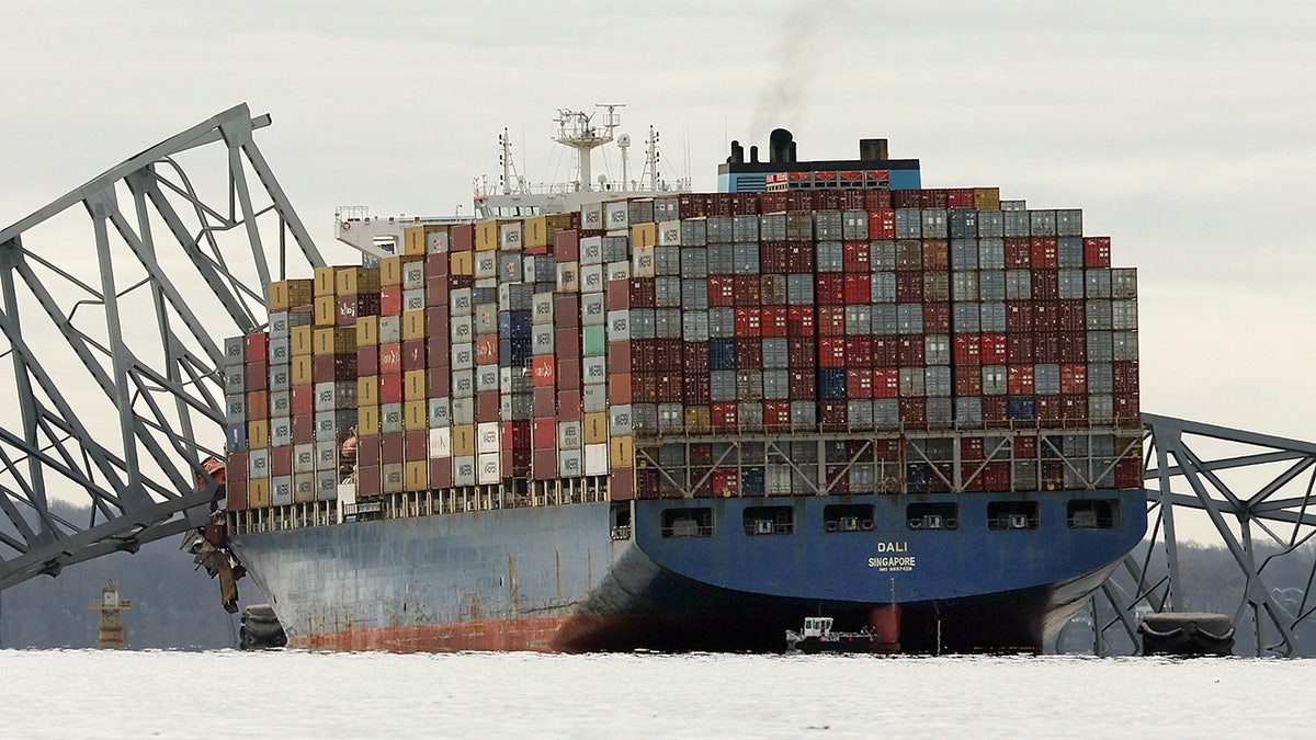 The cargo ship Dali sits in the water after running into and collapsing the Francis Scott Key Bridge