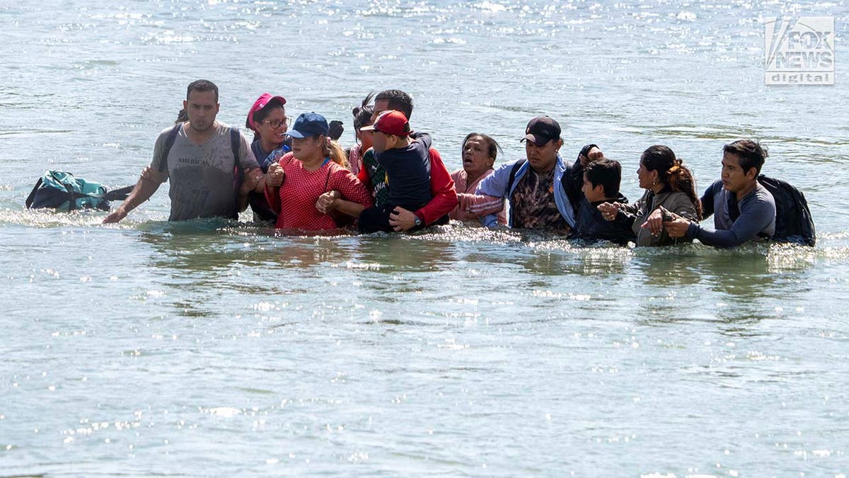 Migrants cross the Rio Grande River to enter the American Border