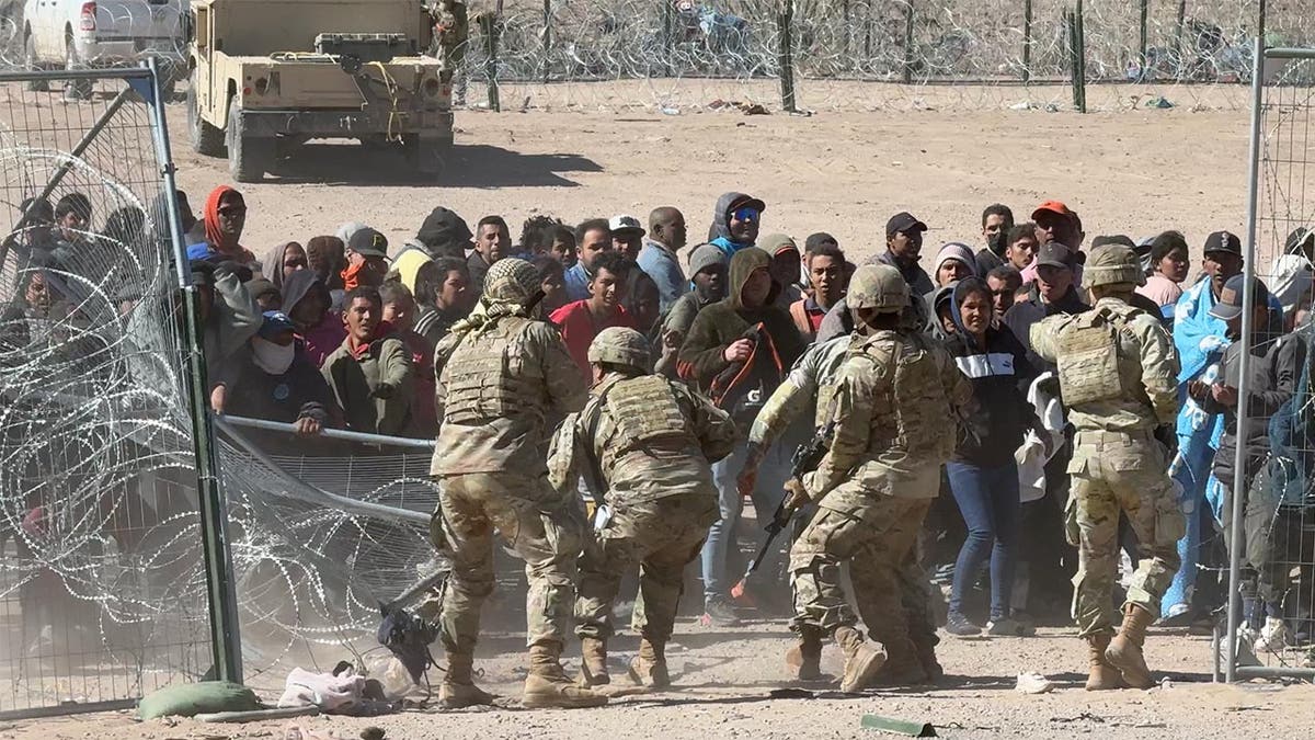 Migrants storm the gate at the border in El Paso